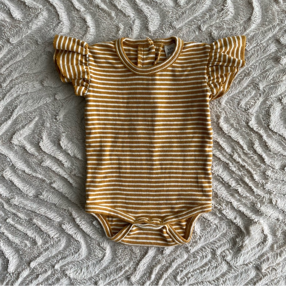 Kate Quinn ruffle sleeve bodysuit